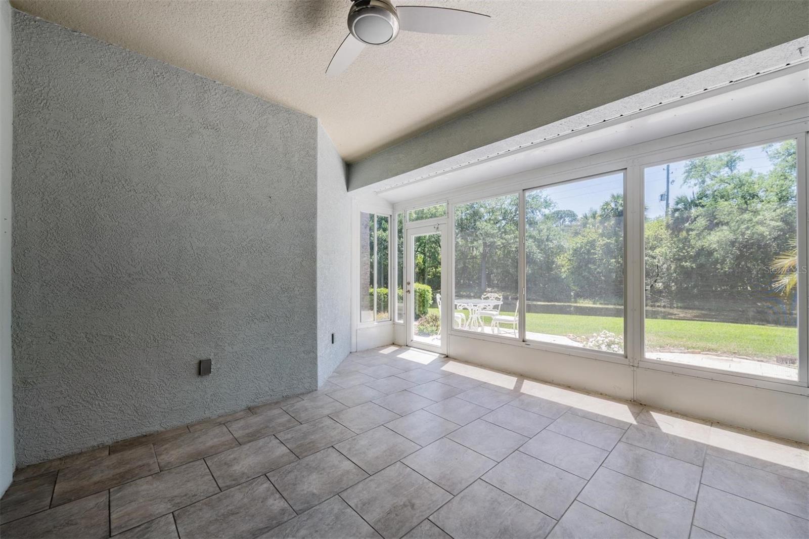 Large enclosed Lanai provides extra living space