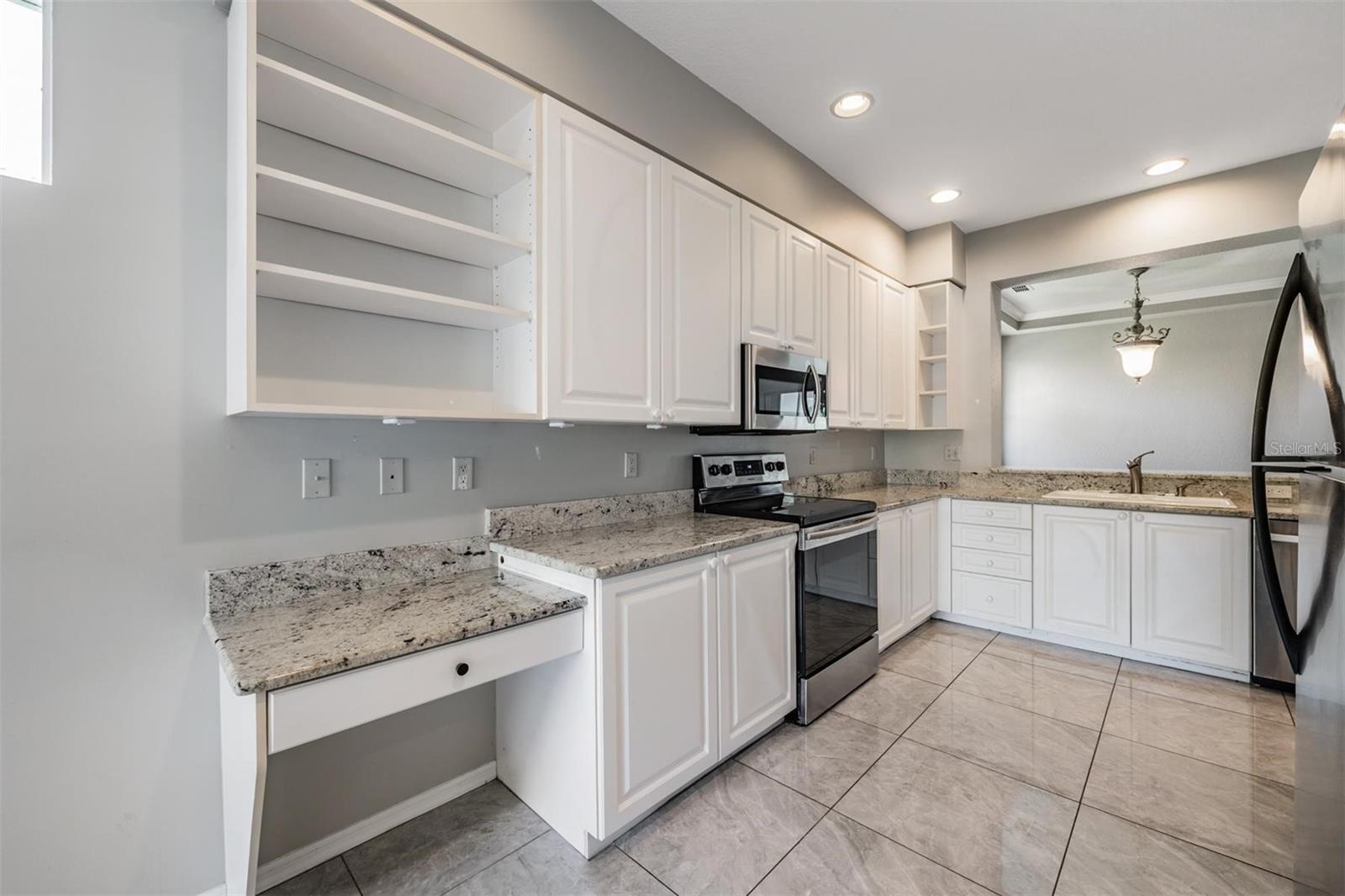 Kitchen features stainless steel appliances