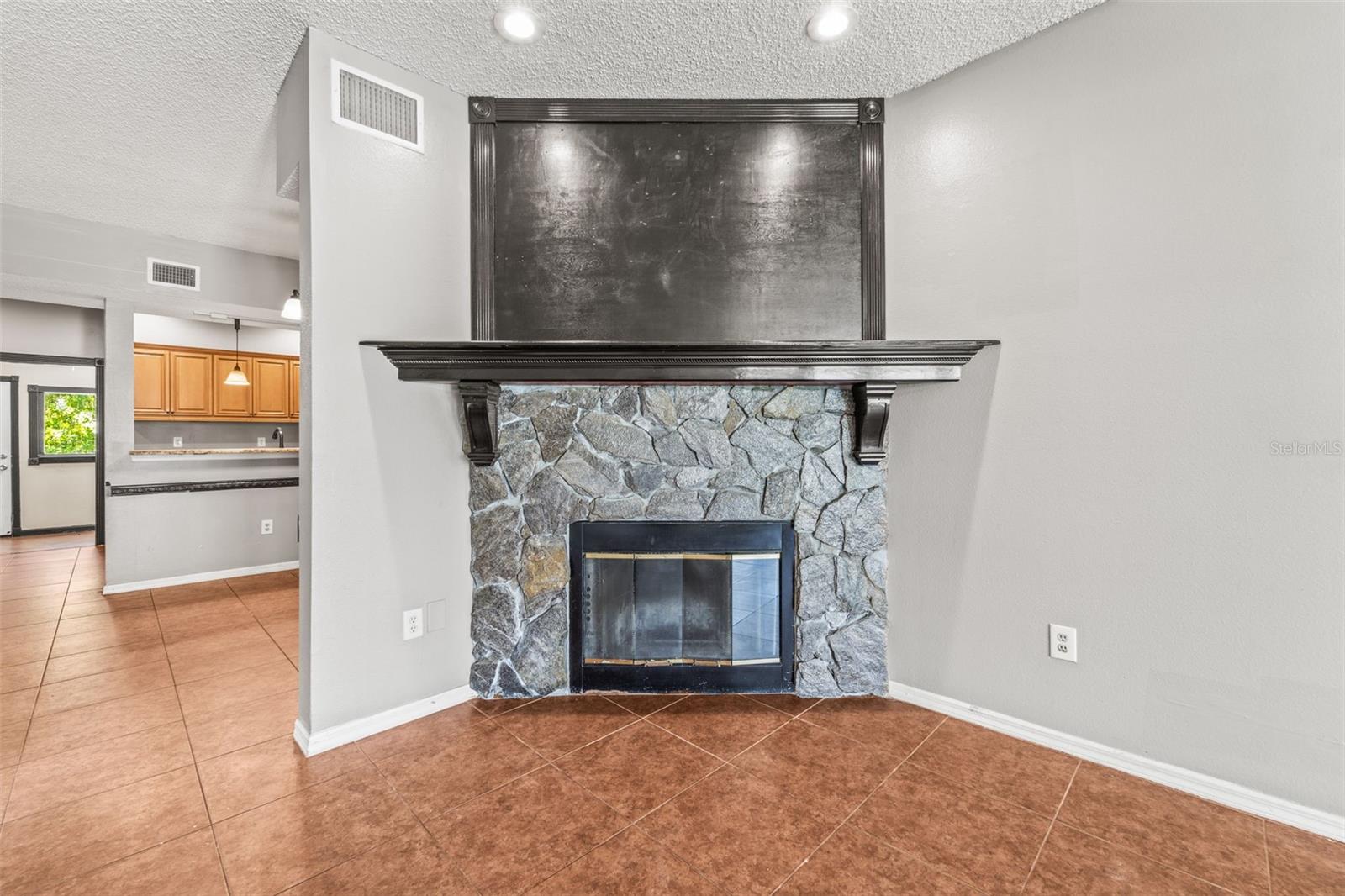 living room with a real wood burning fireplace
