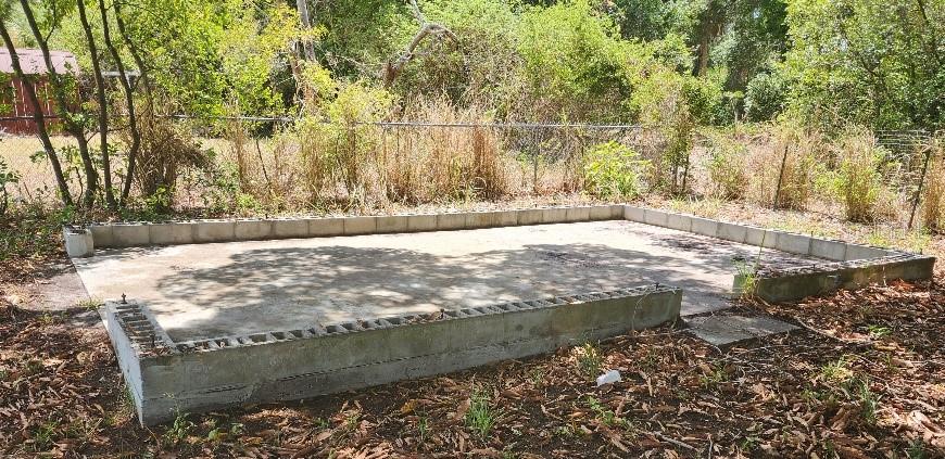 SIDE VIEW OF GARAGE SLAB PERFECT TO BUILD NEW GARAGE OR PUT A STORAGE ON IT.
