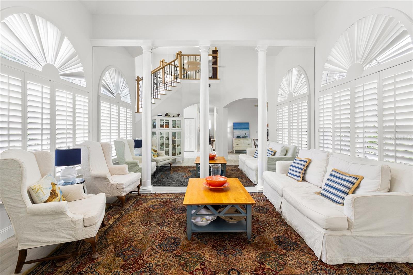 Mirrors and columns reminiscent of Versailles in living room
