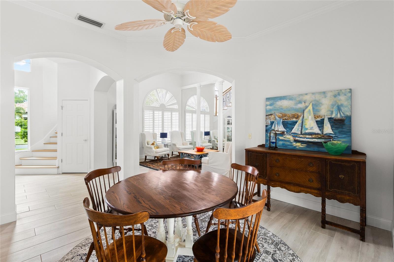 Graceful arches, custom fans and crown molding are luxury touches in this beautiful home.
