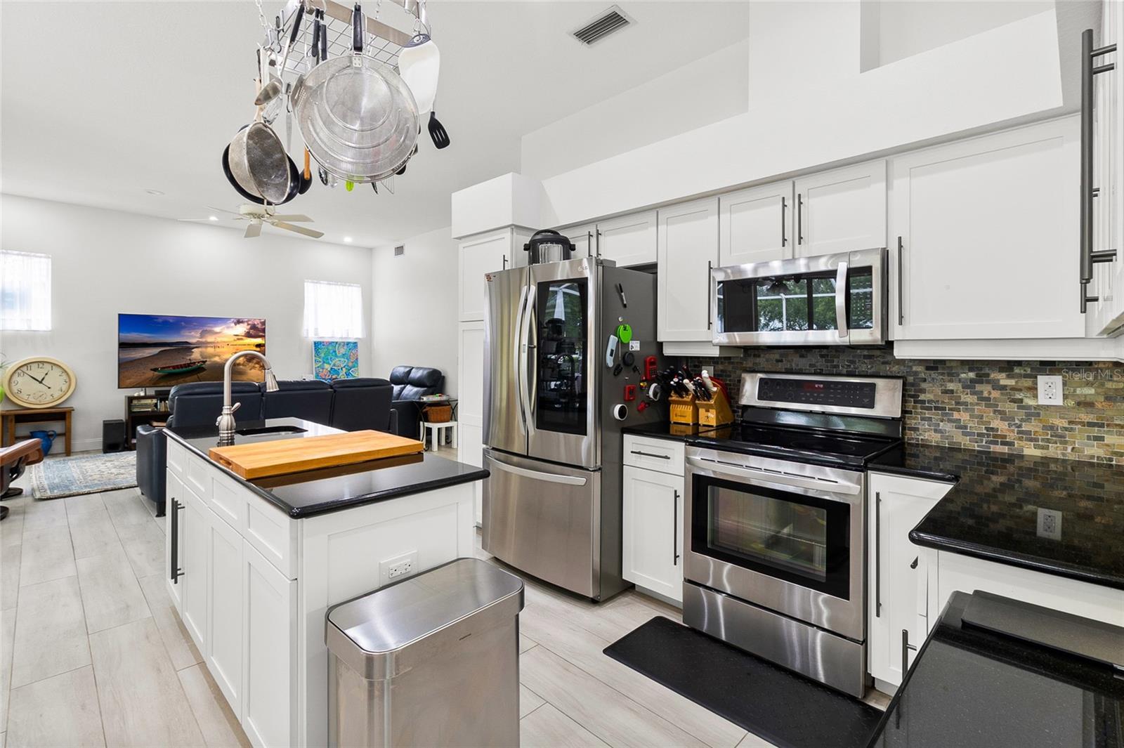 Island has storage and a vegetable sink, convenient for soaking and rinsing food as needed