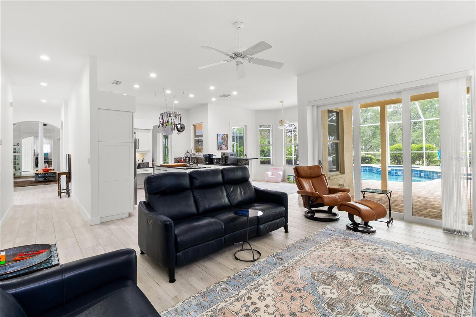 Hurricane proof sliding doors stack into the wall to allow maximum access to pool deck.