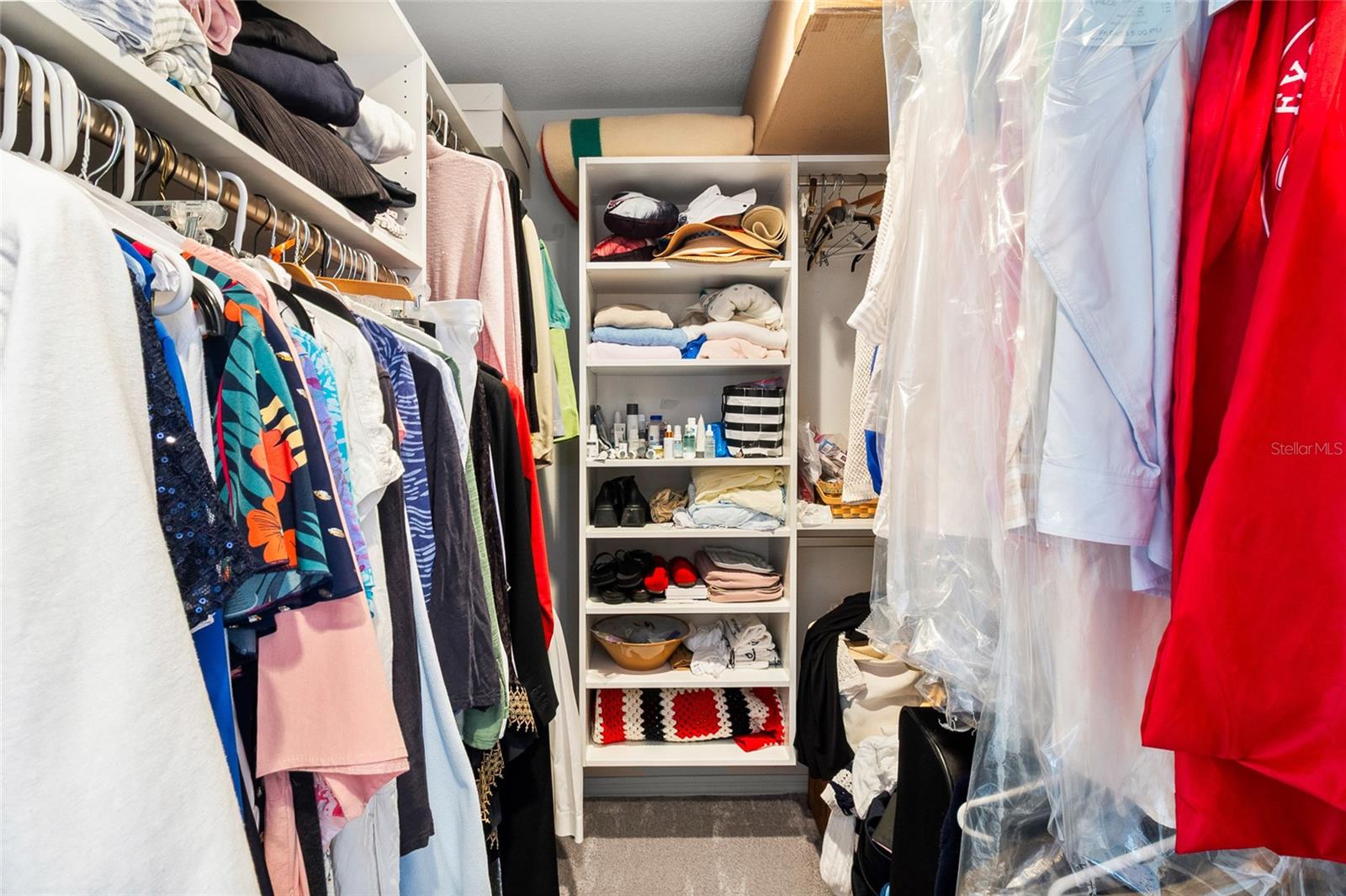 Closets have "california closets" style shelving and storage