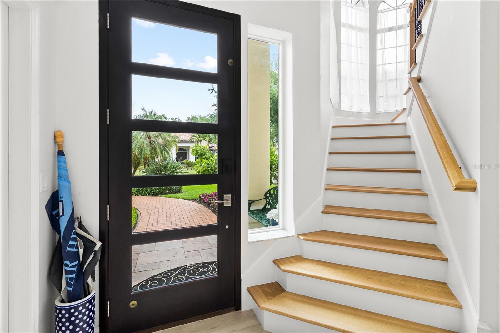 Hurricane proof front door and window.  Staircase is natural white oak.