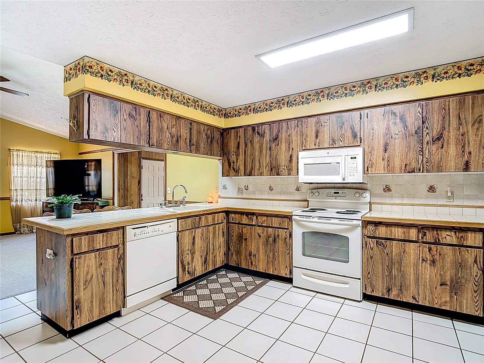 Kitchen opens to eat-in area and family room.
