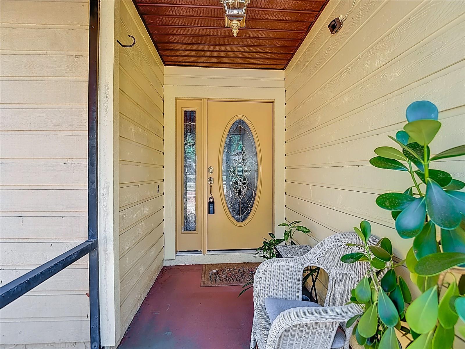 Screened front porch--great for houseplants.