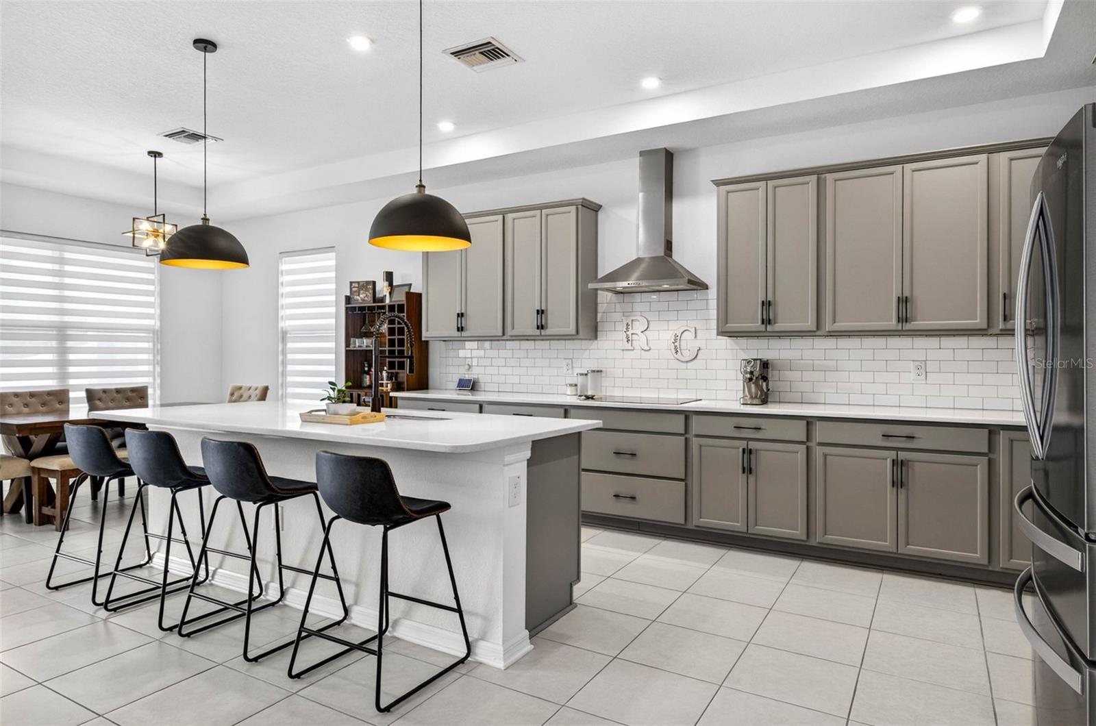 Vented hood, cooktop, double wall ovens & upgraded lighting.