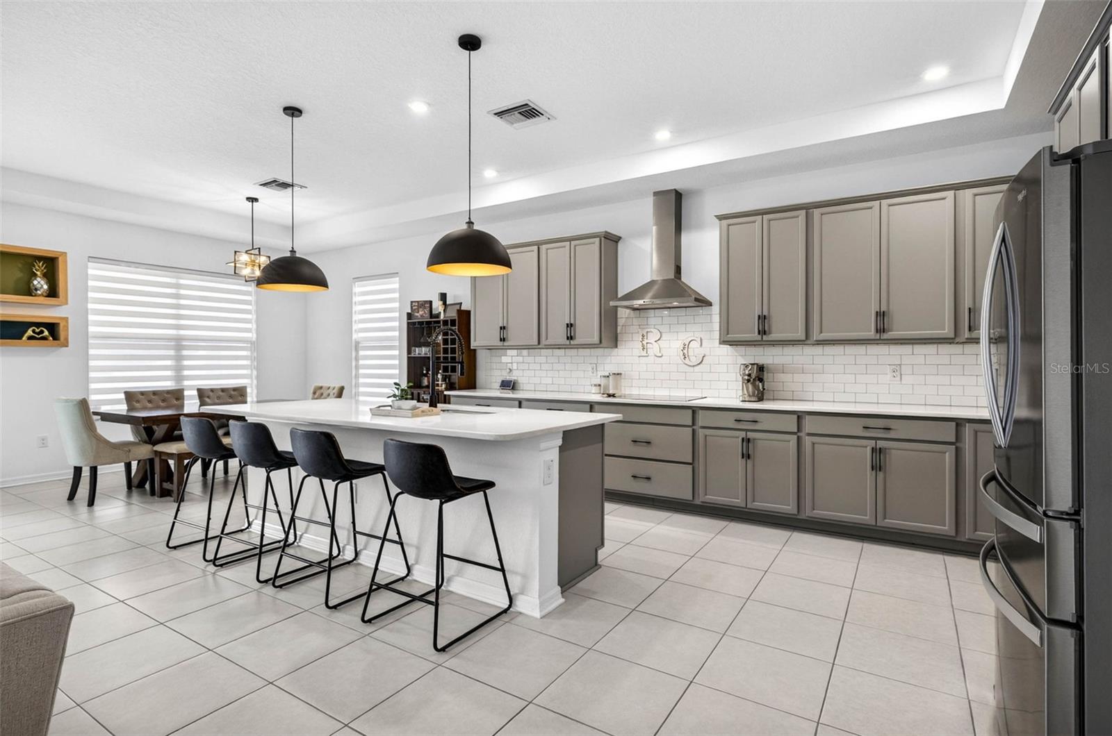 Island seating, upgraded gourmet kitchen.