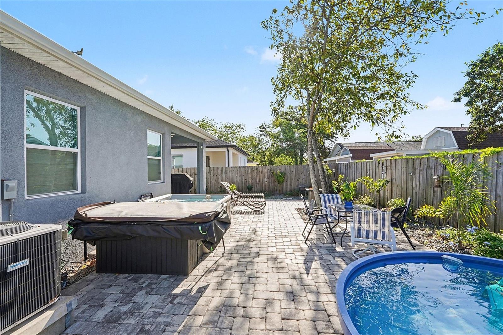backyard showing pool and hot tub