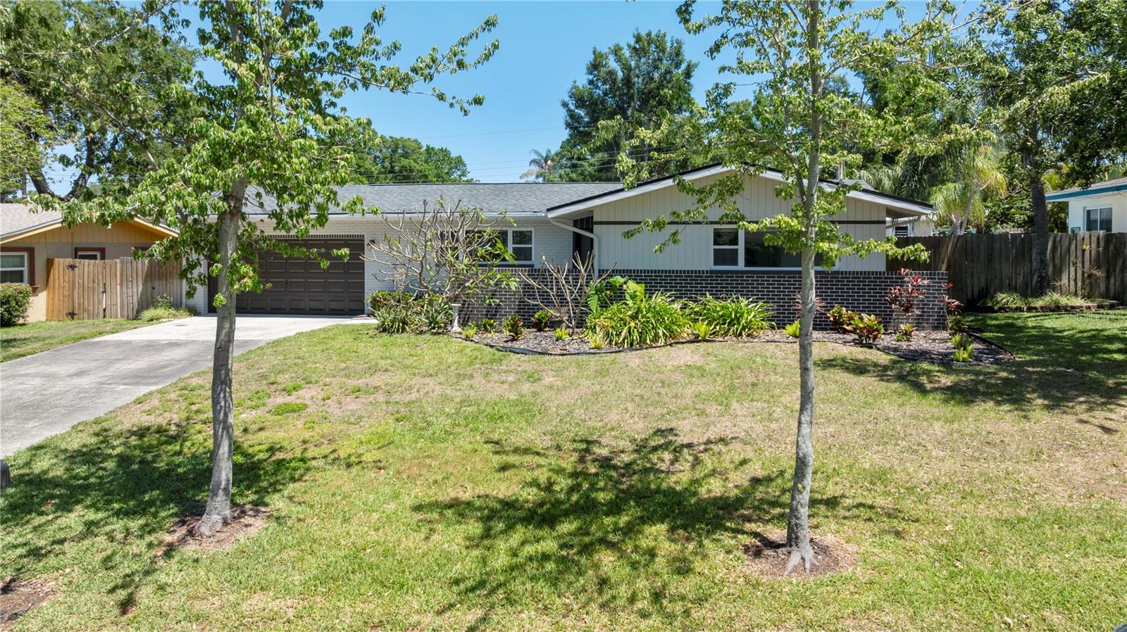 Excellent curb appeal with lush landscaping, classiccharm, and timeless Florida character that instantly feels like home