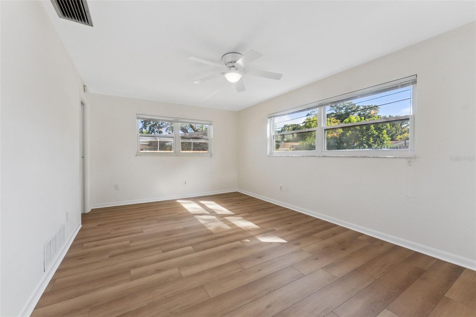 Relax and unwind in the spacious primary bedroom—your private retreat with room to recharge