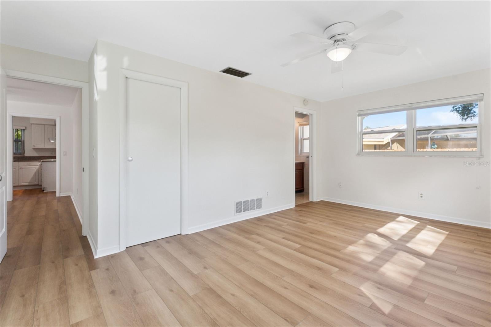 Spacious and serene, the primary bedroom offerscomfort and style—an ideal sanctuary to call your own