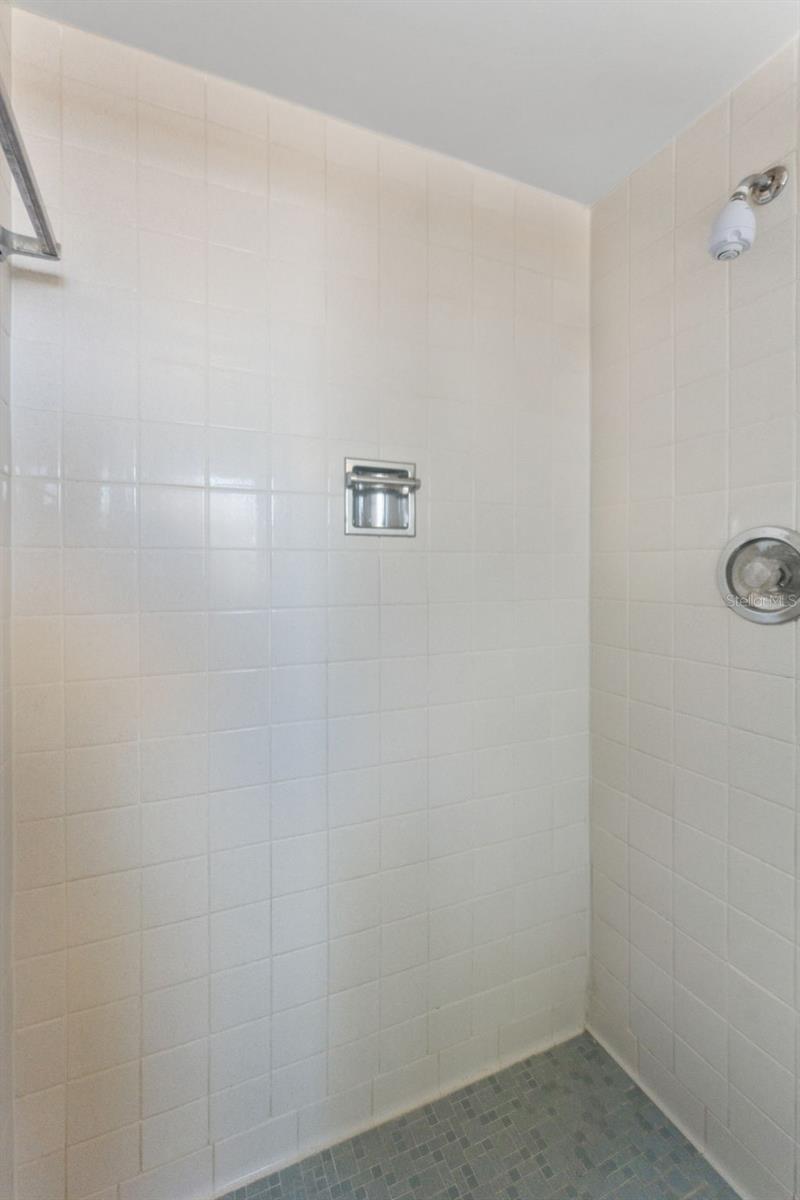 Sleek and modern, the primary bathroom shower isdesigned for relaxation and style