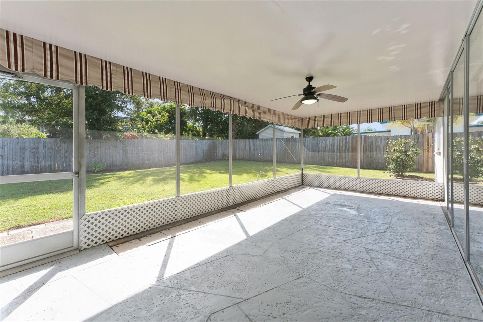 Relax and entertain in style on the very large screened-in back porch—your perfect outdoor retreat, rain or shine