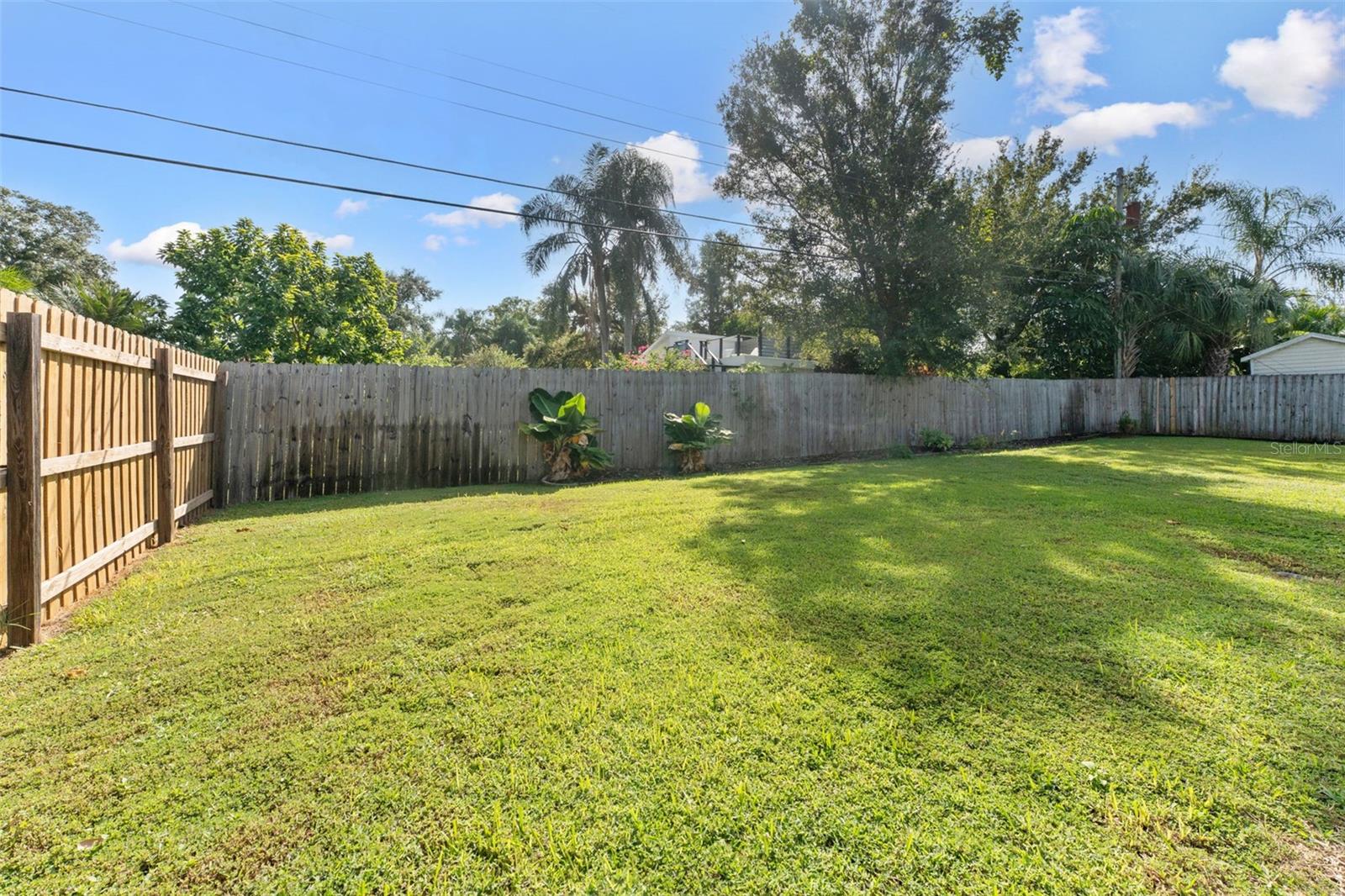 Enjoy your own private oasis! The green, lushbackyard offers plenty of space for play, relaxation,and outdoor entertaining