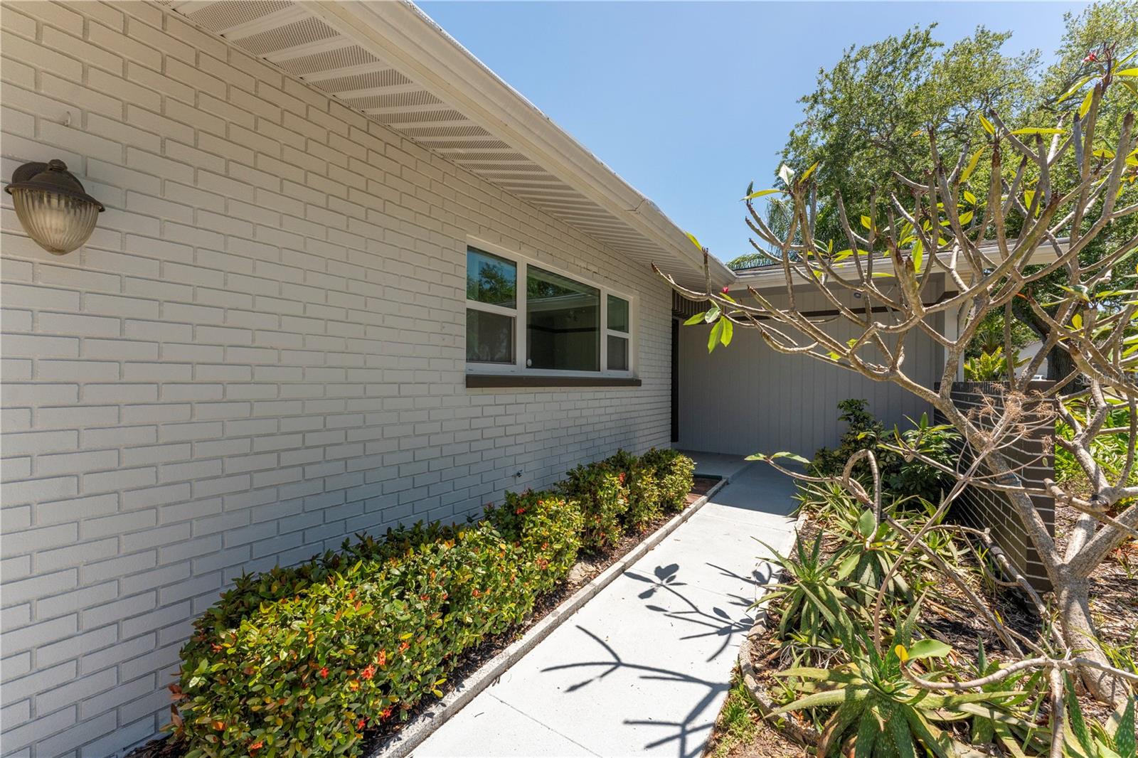 Charming walkway leading you right to the frontdoor of your new Clearwater home