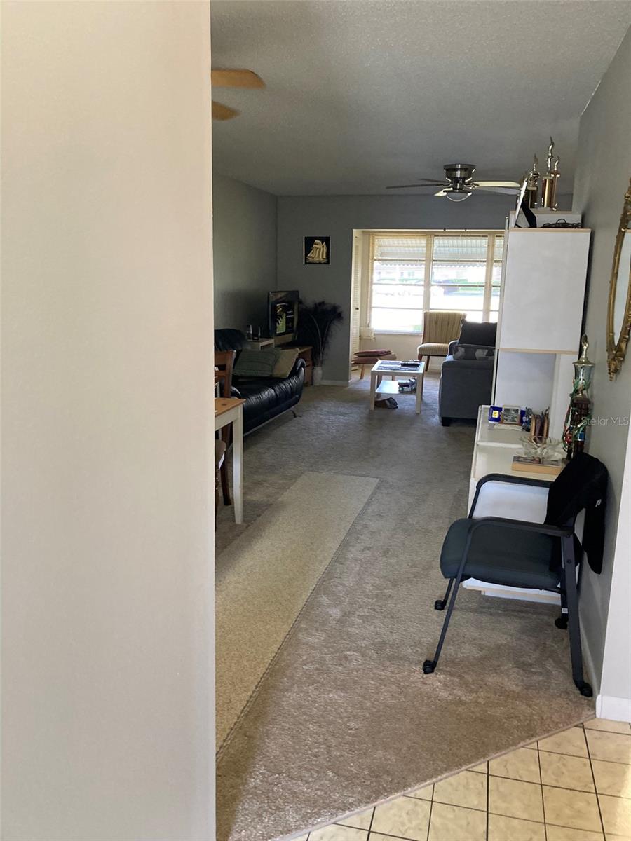 Living/dining area with bonus space at the back