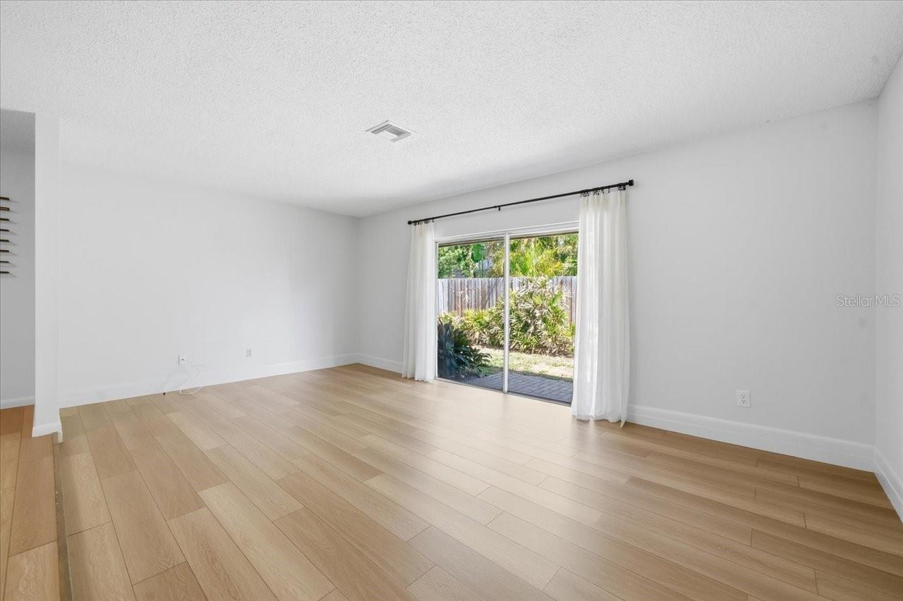 Living room with sliding doors to side yard