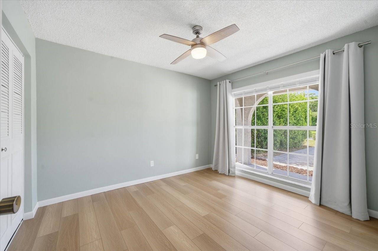 2nd bedroom with amazing window overlooking the front porch!!