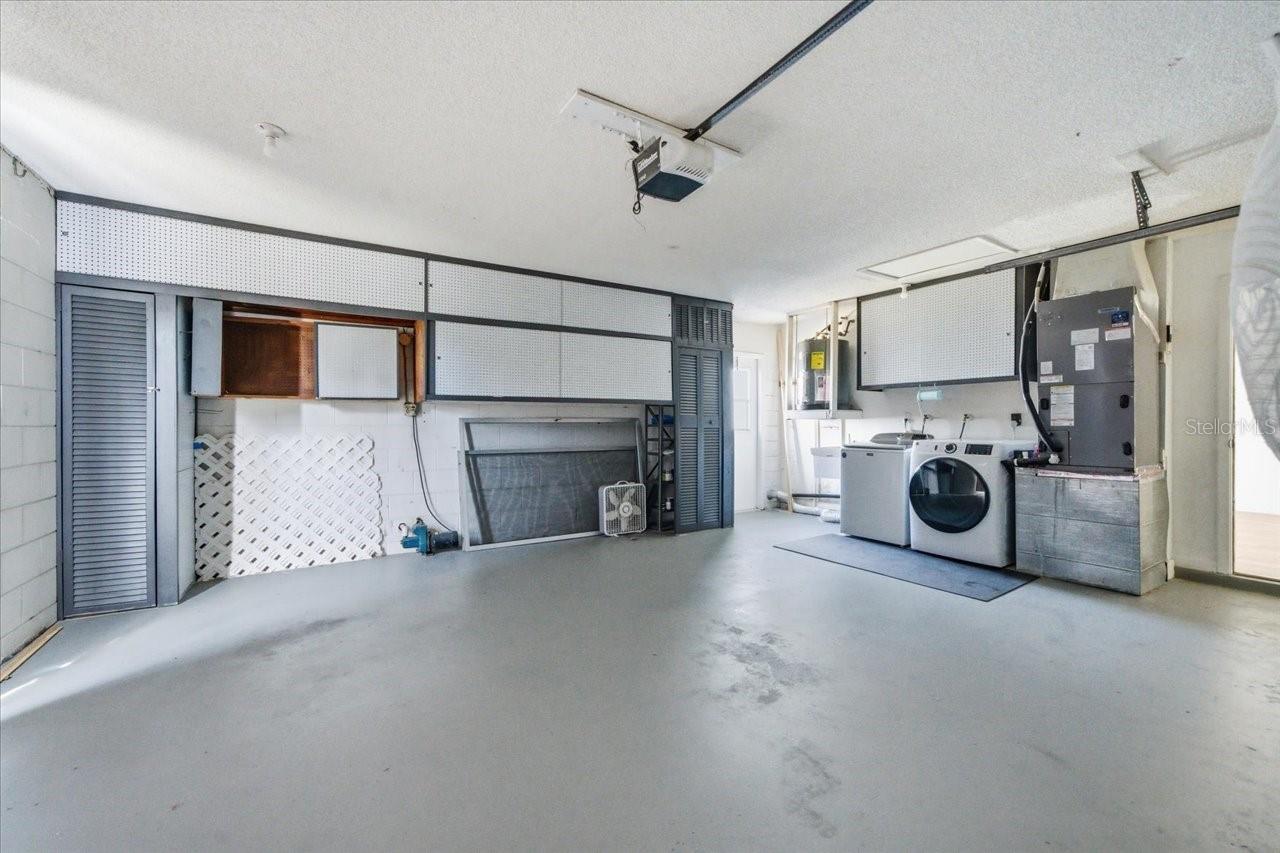 Large garage with built in storage and laundry