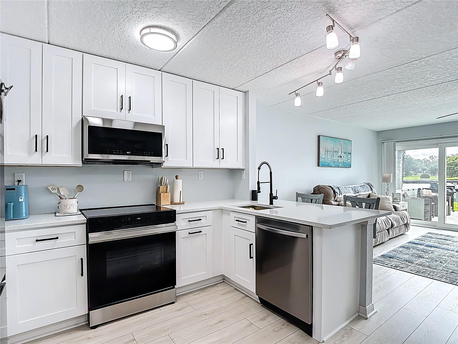 Open floor plan with breakfast bar.