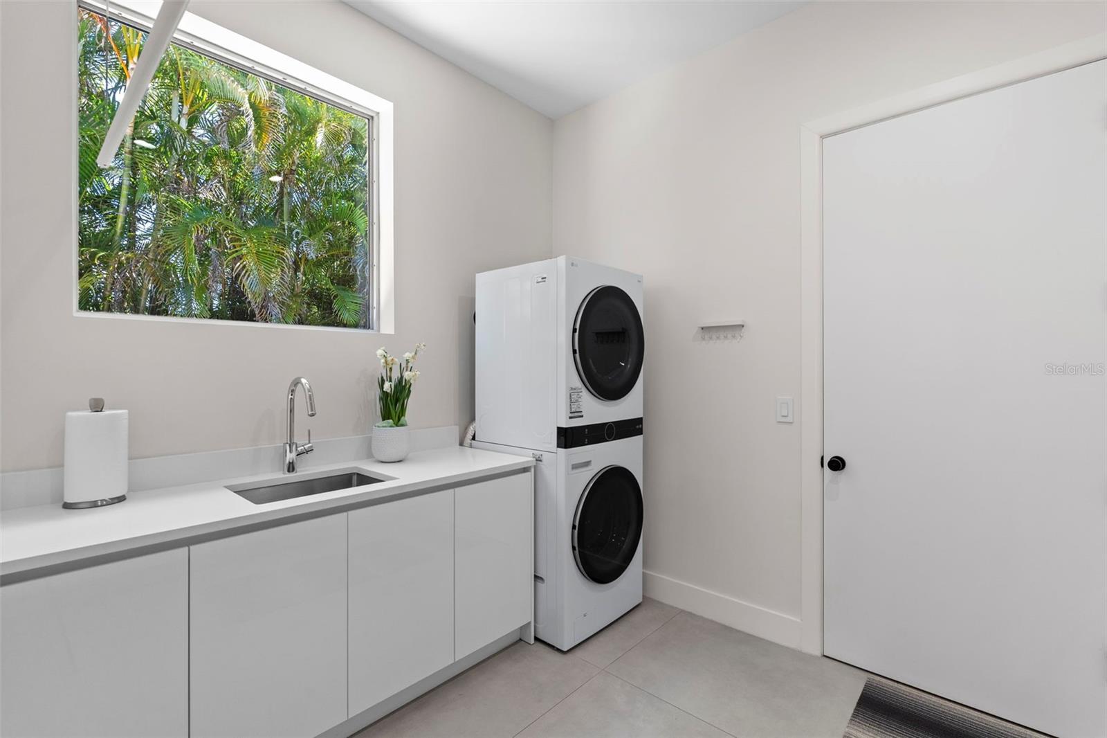 Laundry Room With Abundant Storage Space, Utility Sink And Plenty Of Natural Light