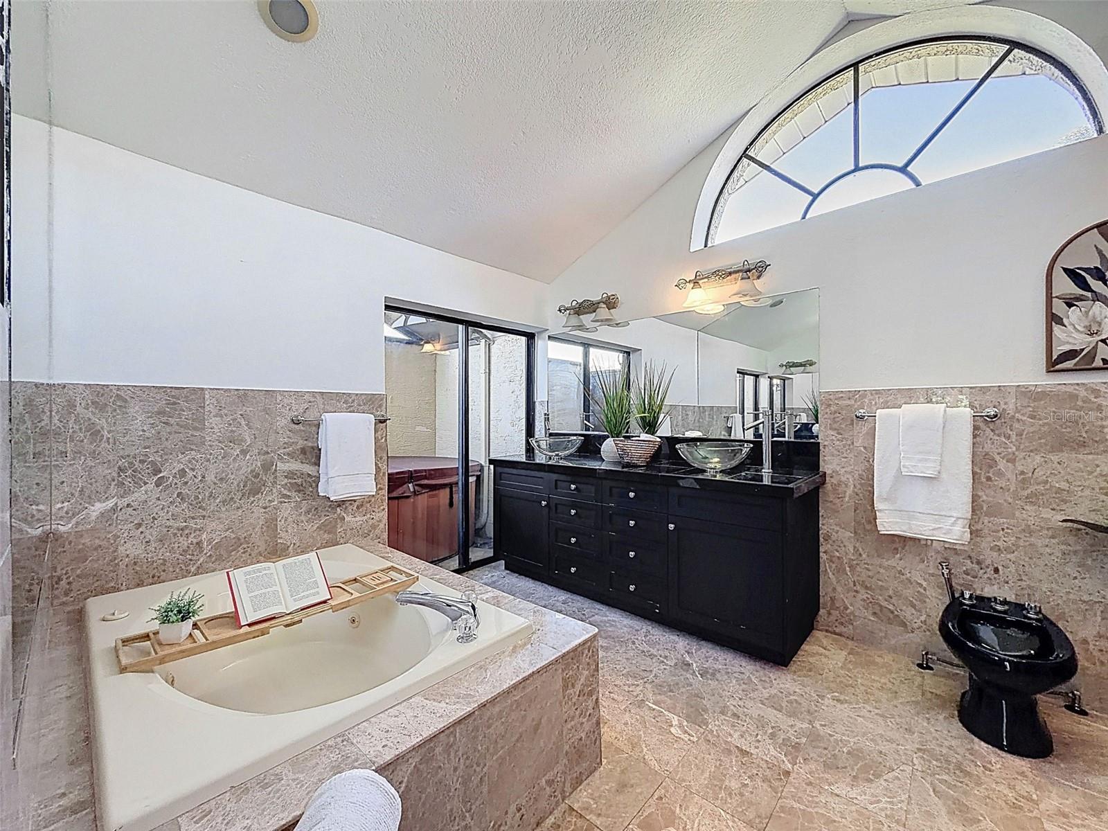 Primary Bath with a relaxing tub & private jacuzzi area