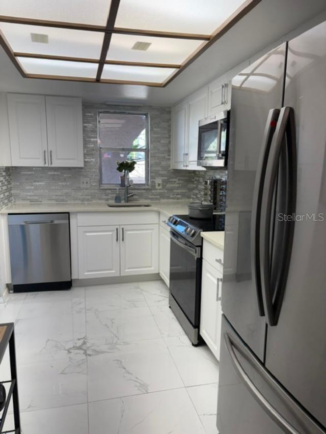 long view kitchen with new appliances