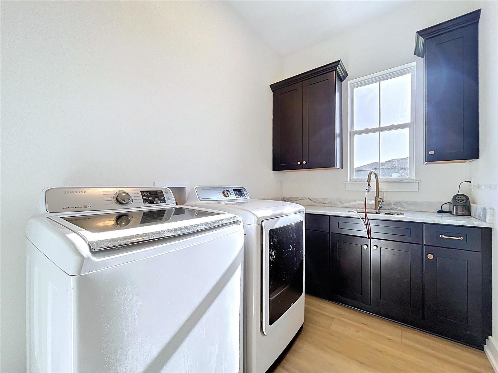 Laundry Rm with entrance to the Master Closet