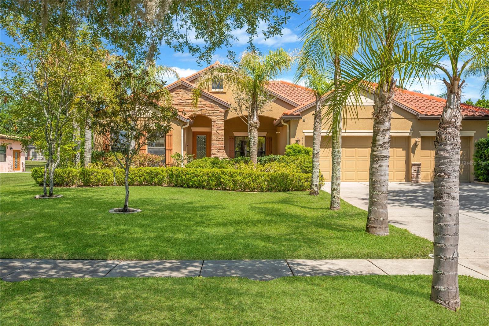 5-bedroom, 3-bath, 3-car garage home situated on a sprawling half-acre lot.