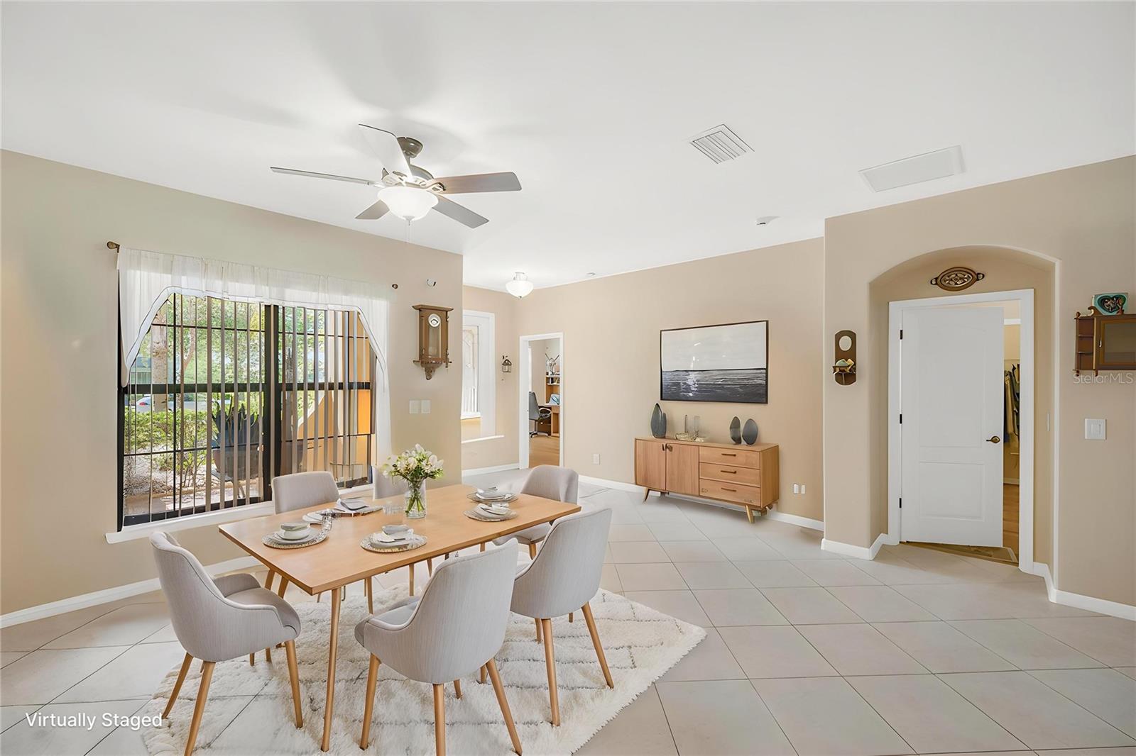 The open floor plan is designed for everyday living and effortless entertaining. Large-format ceramic tile set on a diagonal flows throughout the main living areas.
