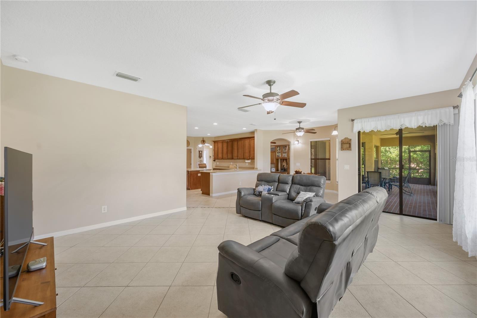 There is direct access to the covered and screened lanai through sliding doors in the family room and living room.