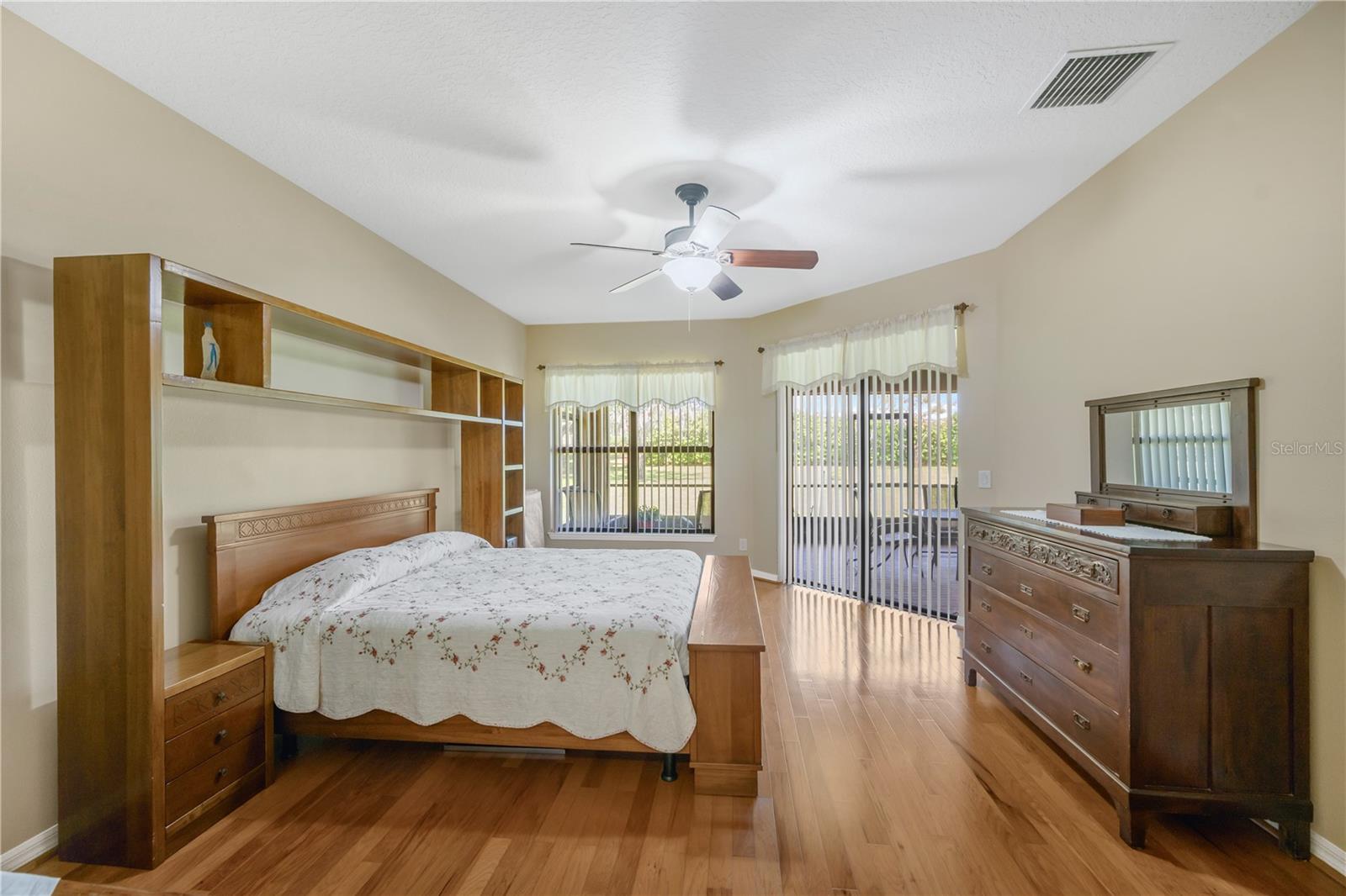 The primary suite is a private retreat with lanai access and dual walk-in closets and an ensuite bathroom.