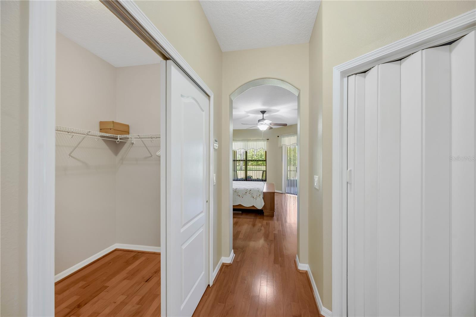 Dual walk-in closets in the primary suite offer exceptional storage space and organization potential.
