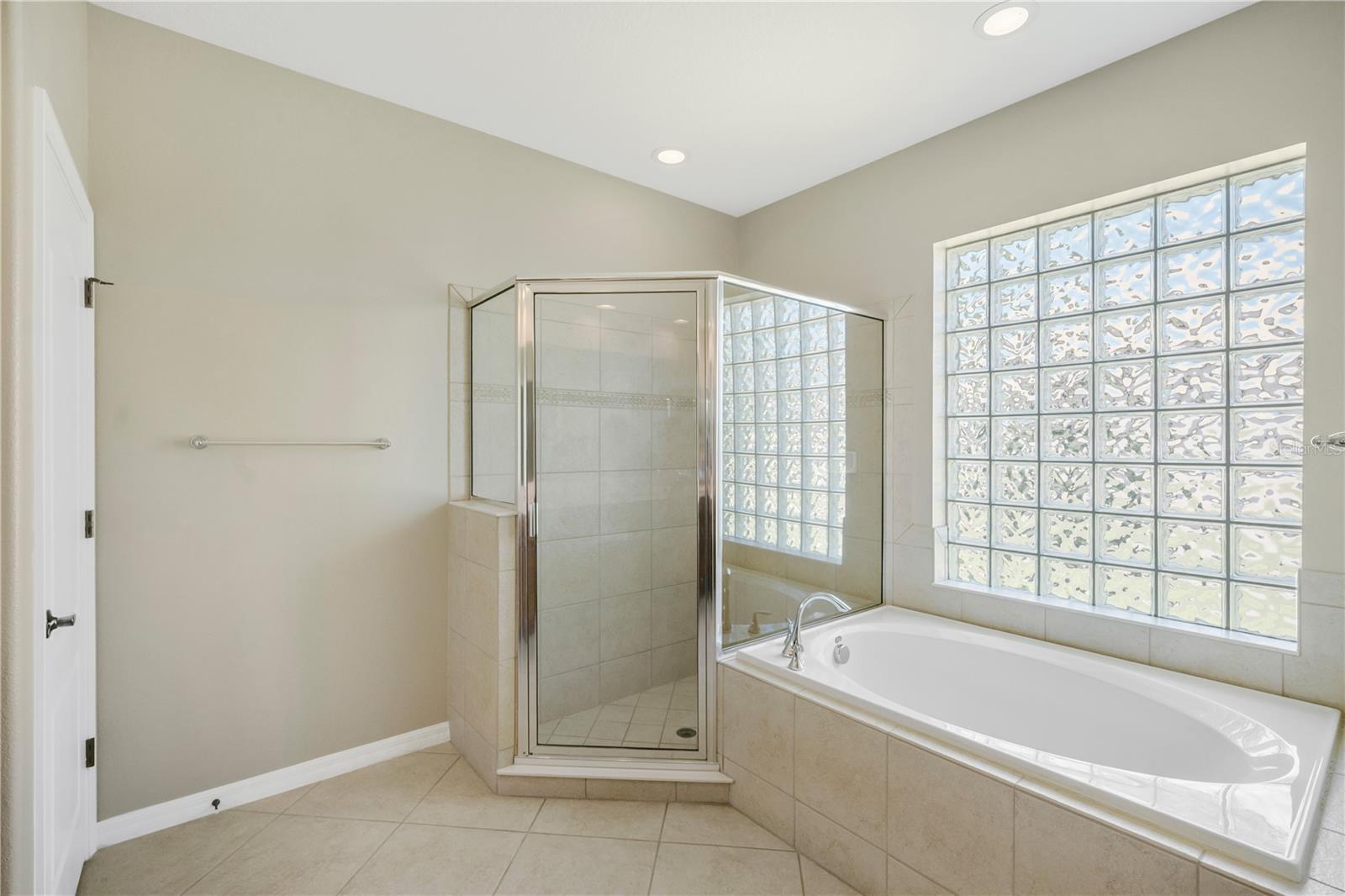 Buyers will enjoy a separate soaking tub and shower, creating a relaxing spa-like experience.