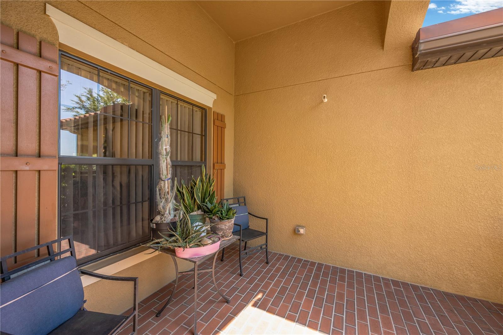 There is a charming front porch area to pause and soak in the meticulous landscape.