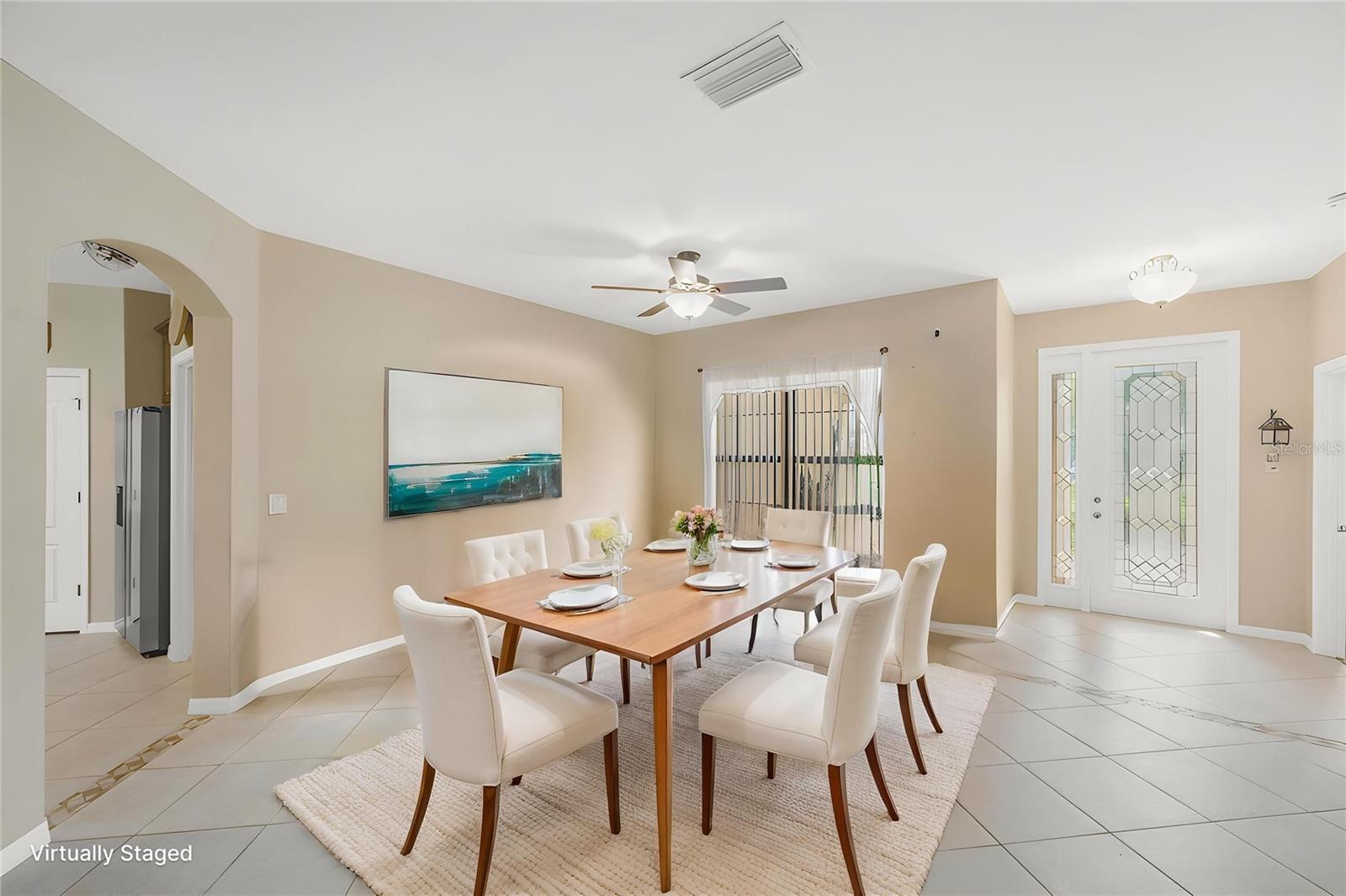 Just beyond the beautiful leaded glass front door with sidelight is the Dining/Living room area.