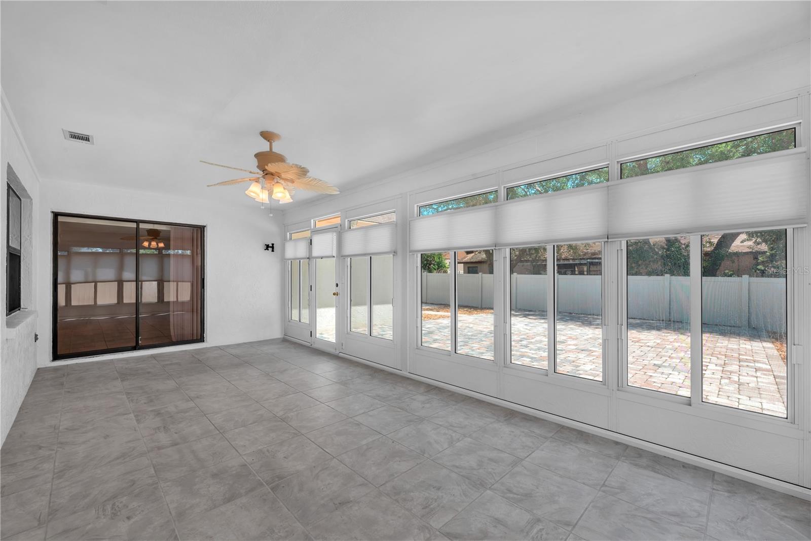 View of Florida room looking back at sliding doors to acess the family room.