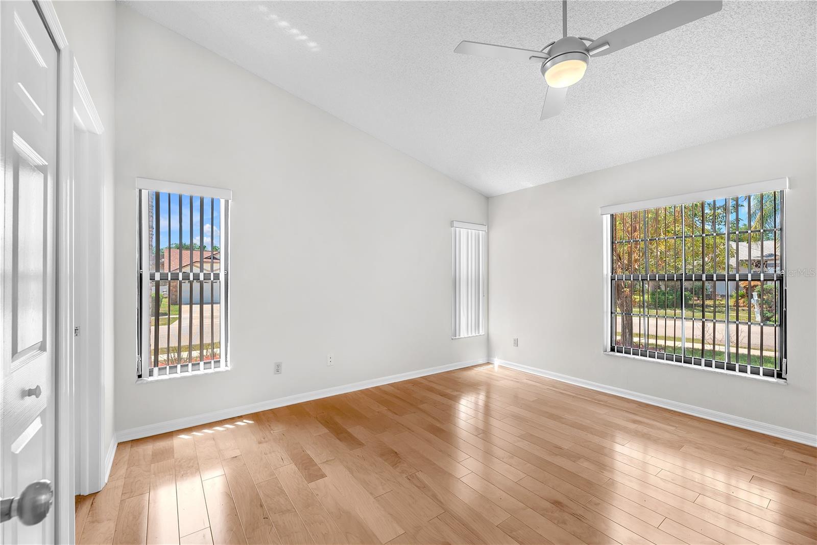 The spacious primary suite offers a generously sized walk-in closet and an updated bathroom.