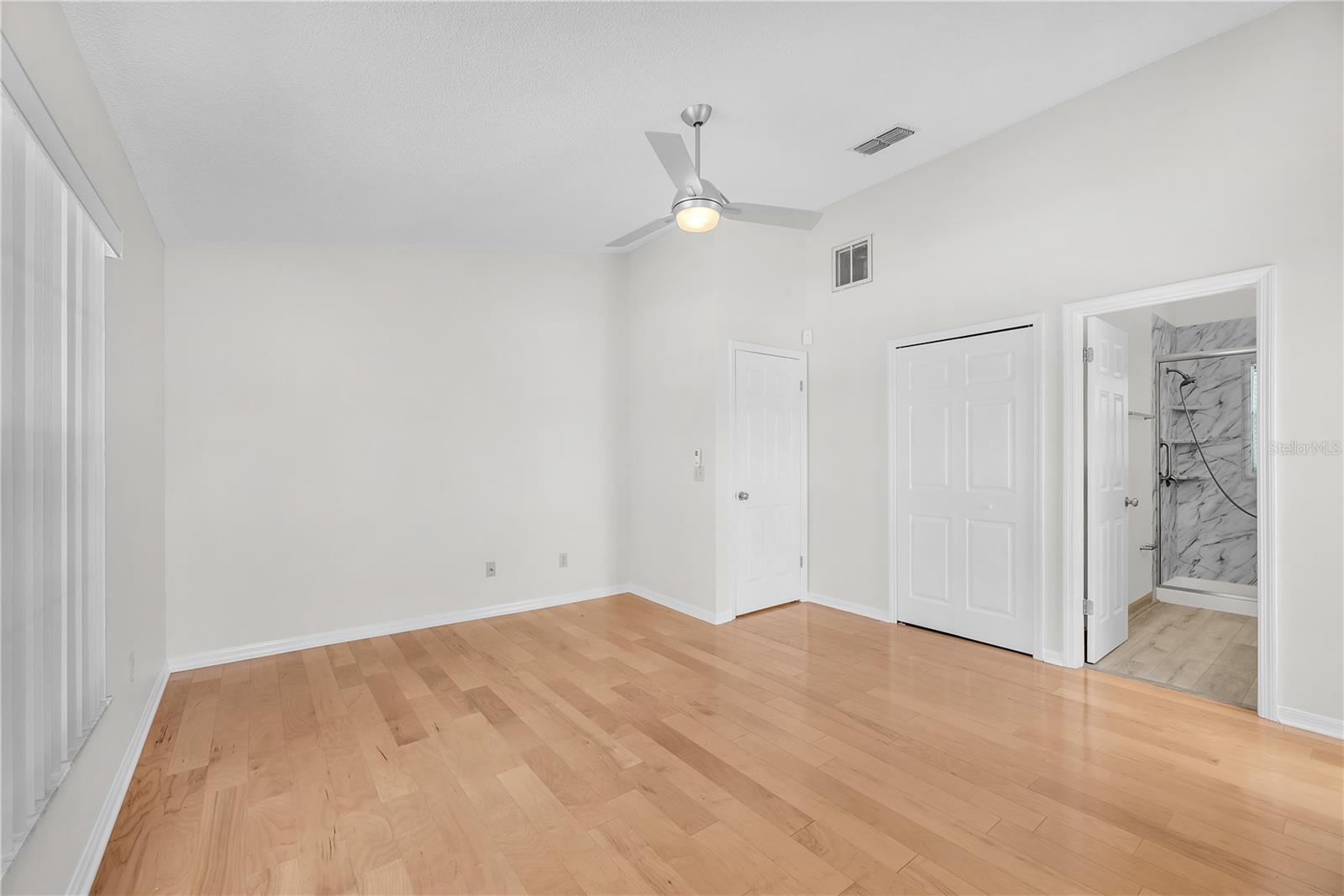 Main bedroom looking at 9' x 6' walk-in closet  and ensuite bathroom.