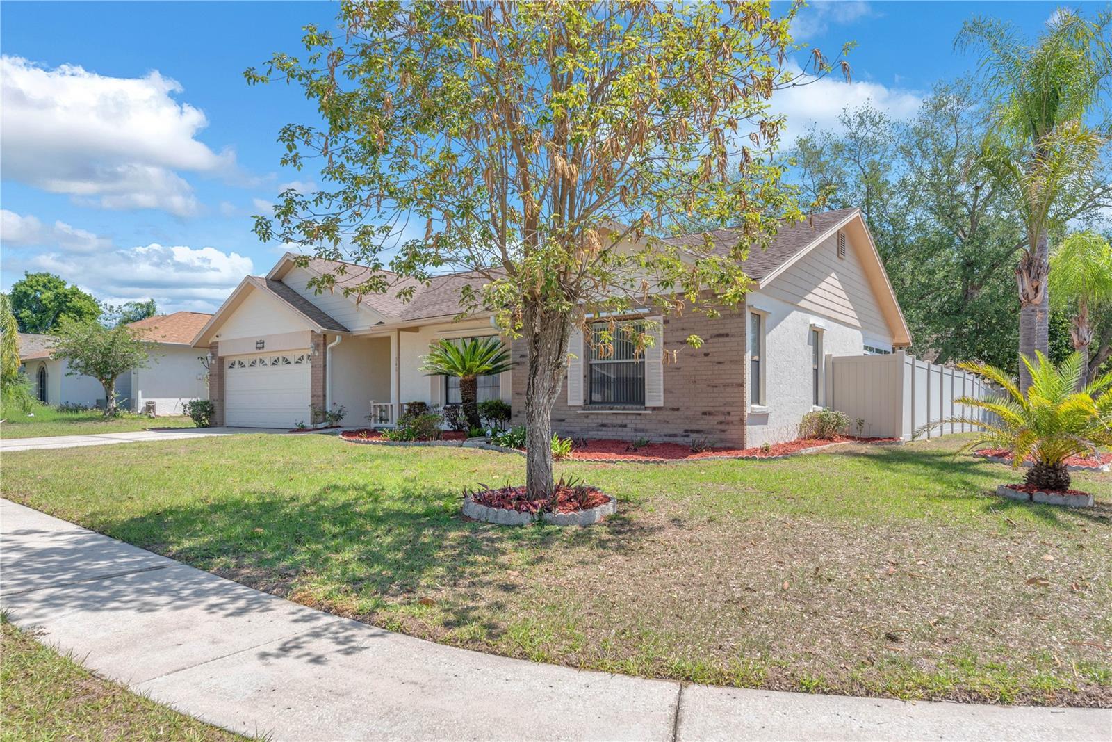 Situated on a spacious corner lot in Highland Ridge.