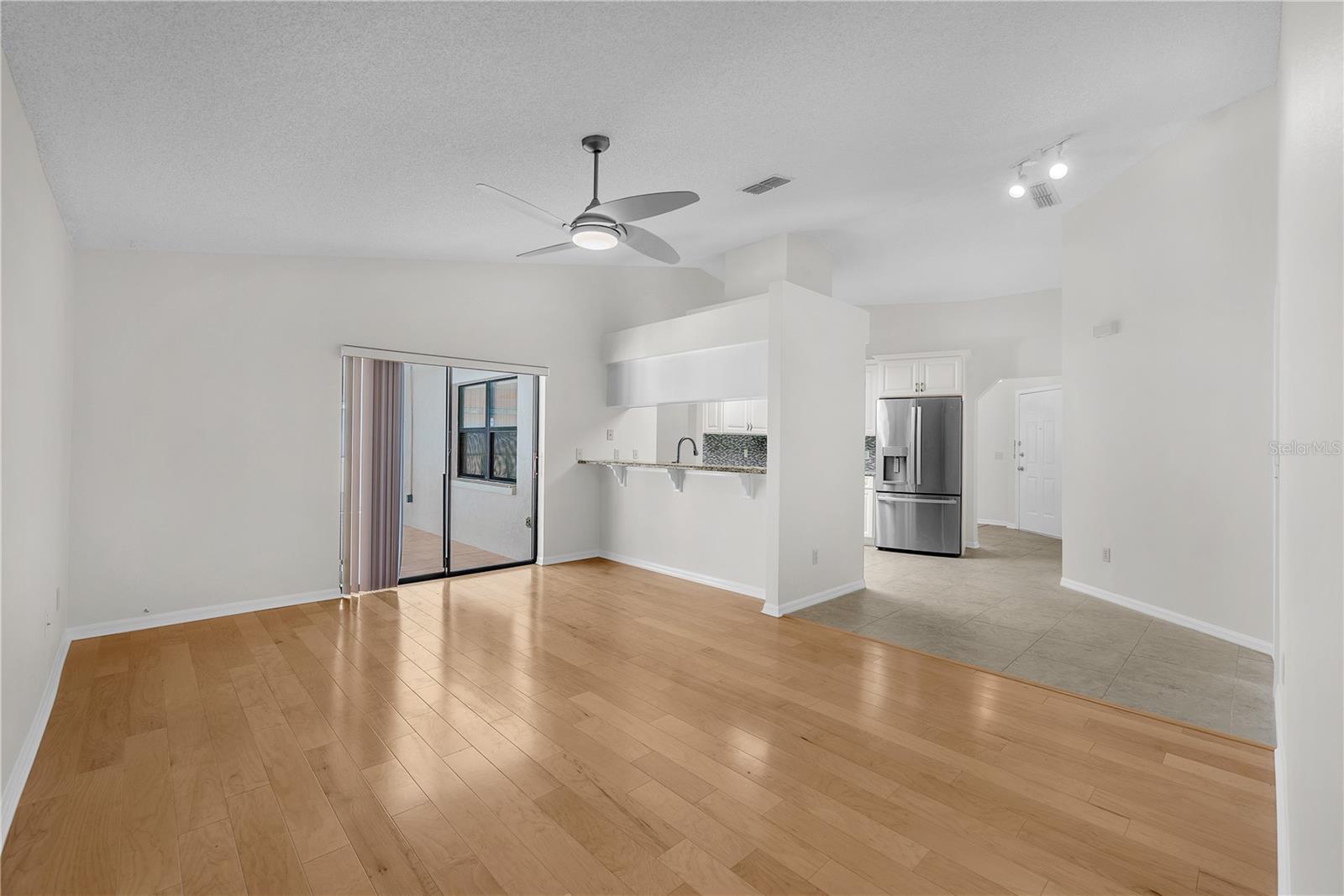 This family room/kitchen combination feels light and airy and there is space to add a casual dining table.