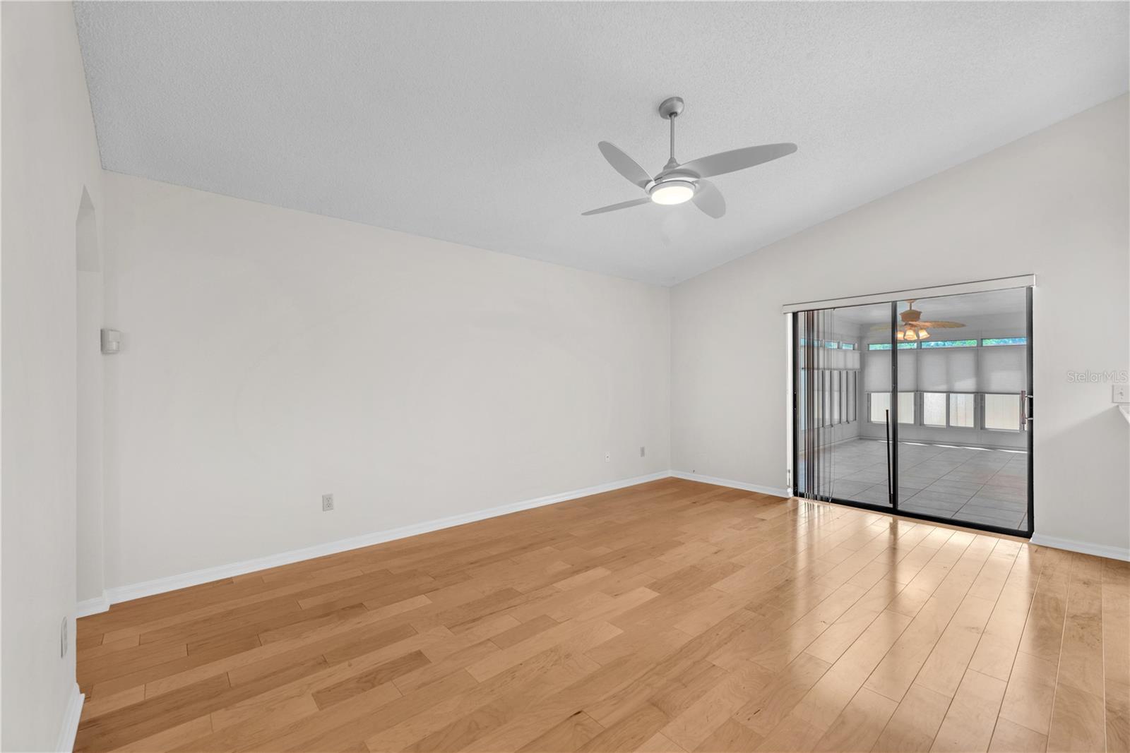 Sliding glass doors in the family room lead to an oversized enclosed Florida room—an ideal extension of your living space overlooking the fenced backyard.
