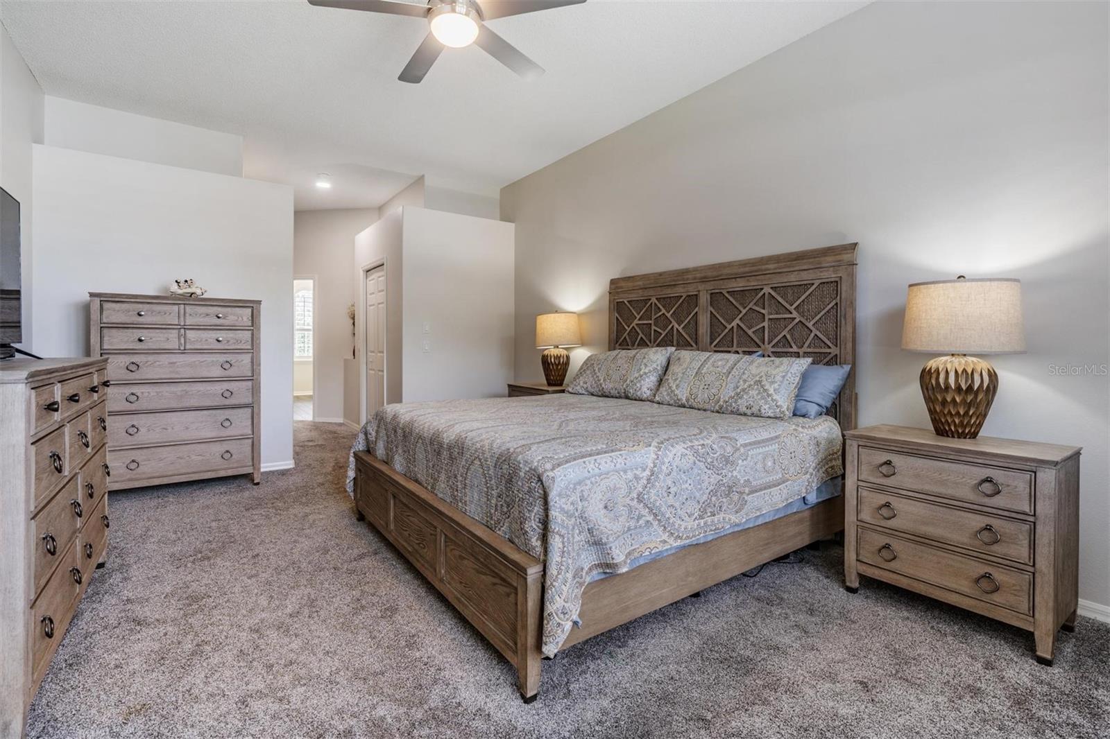 Primary bedroom with neutral color palette