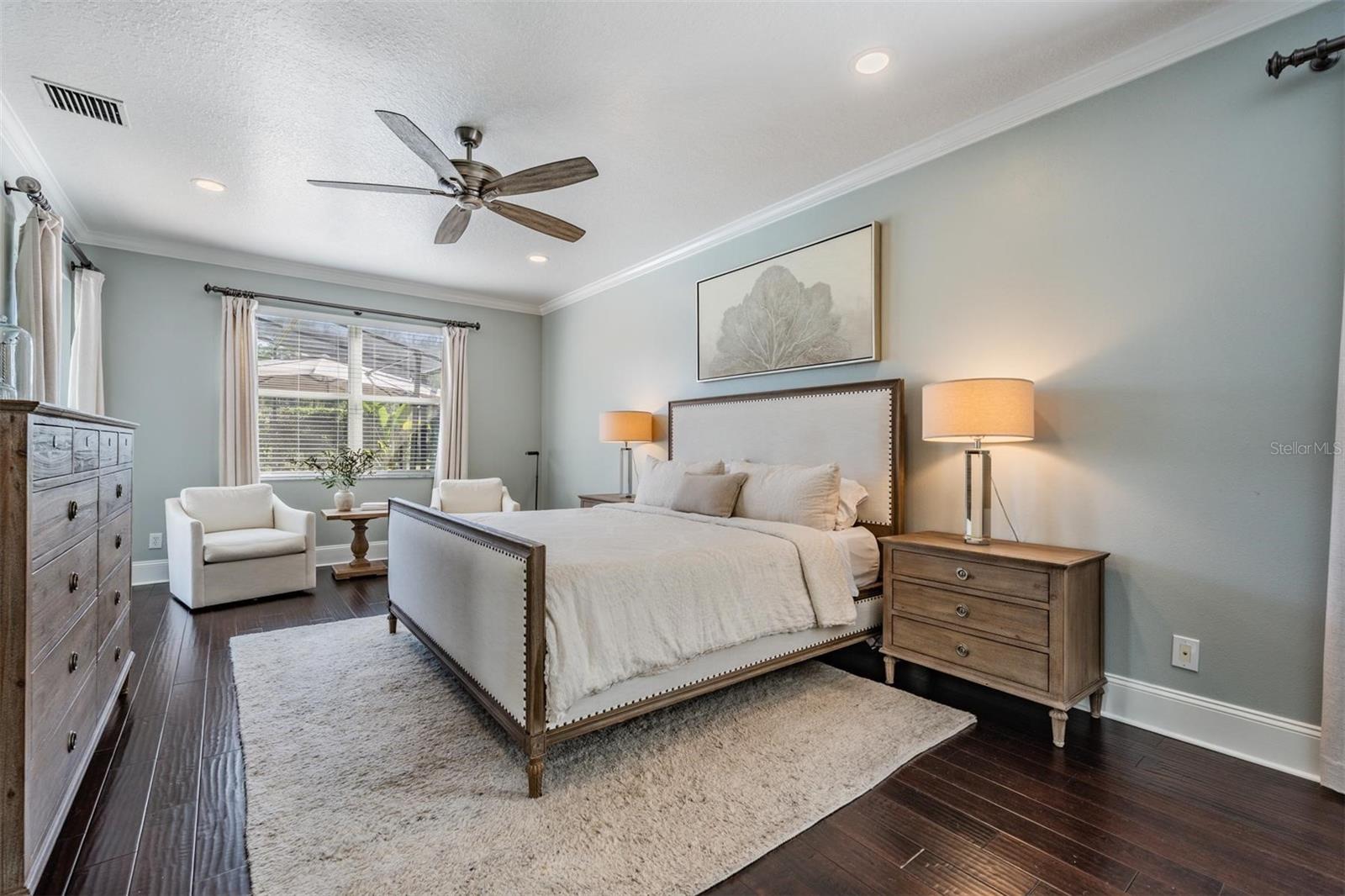 Master bedroom with crown molding and lanai view