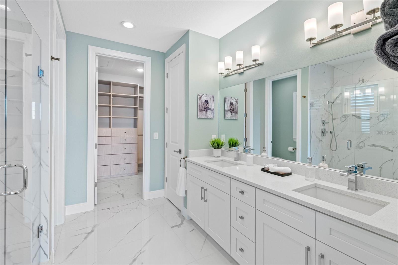 Primary Bathroom with walk-in closet and large linen closet