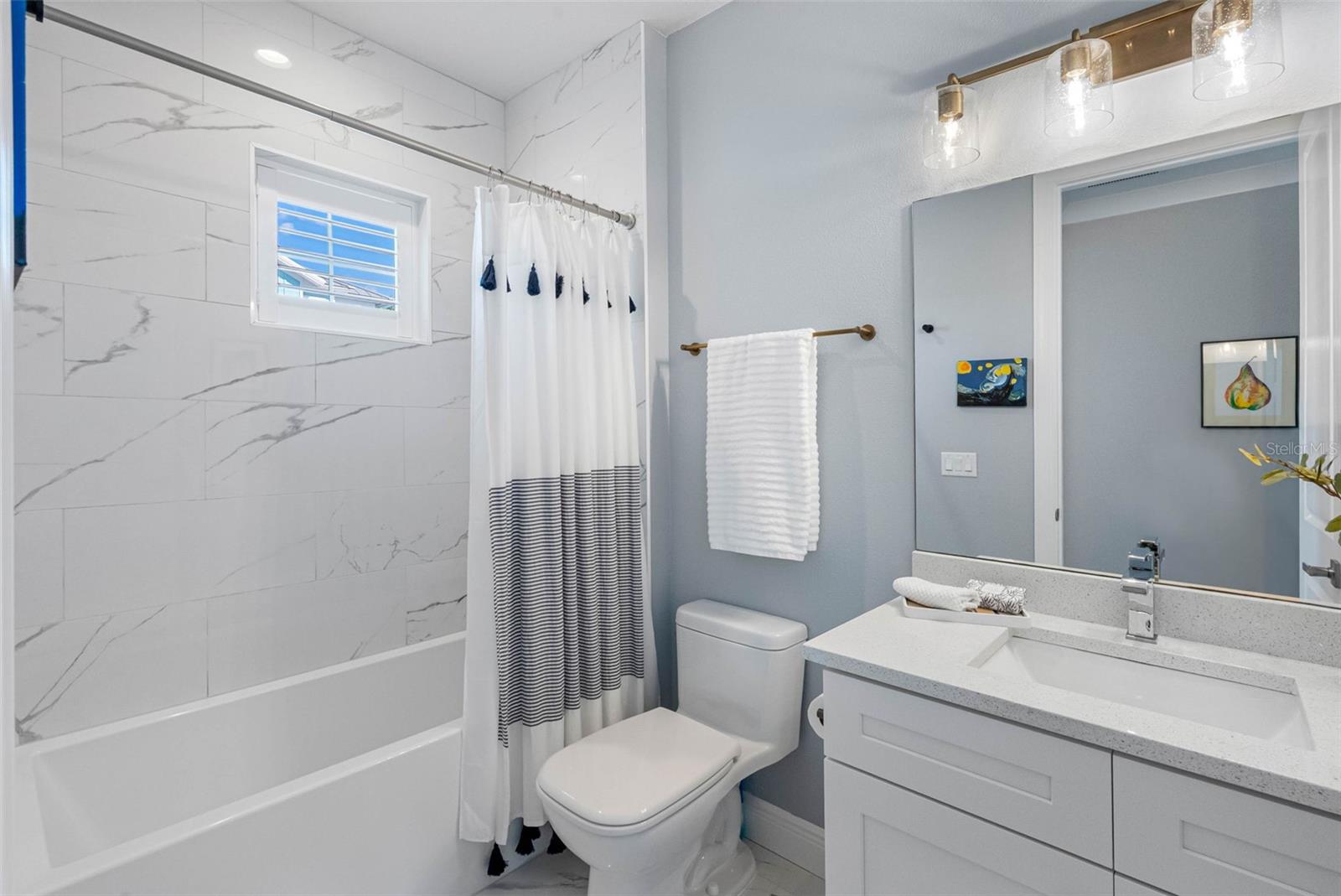 Second Full Bathroom on the Second Level Stone Counters and Tub/Shower Combo