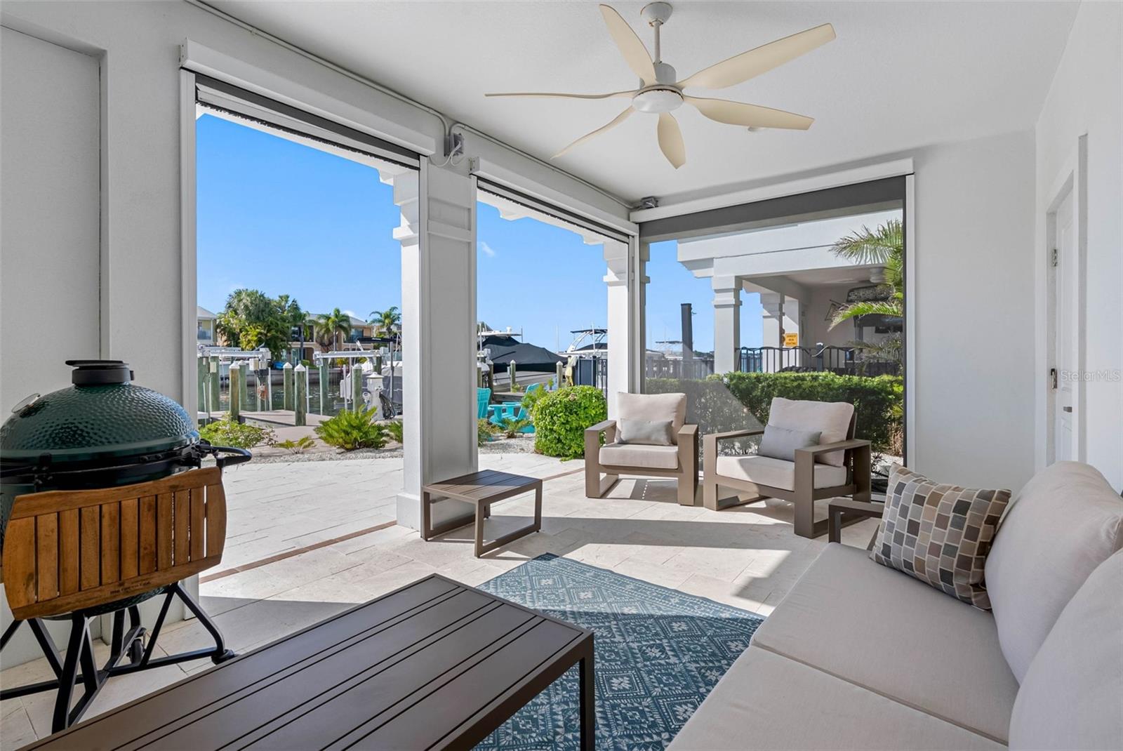 First level rear covered patio with motorized screens